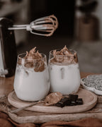 Whipped coffee drinks and chocolate on a wooden tray, edited with brown Lightroom presets