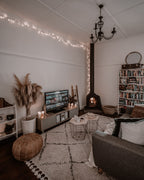 Living room with a wood-burning stove, edited in warm, muted brown tones